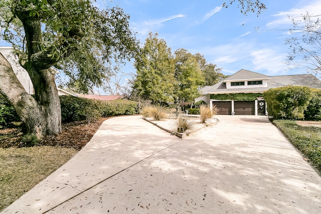 exterior space featuring driveway and a garage