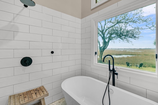 full bathroom featuring tiled shower, tile walls, and a freestanding tub