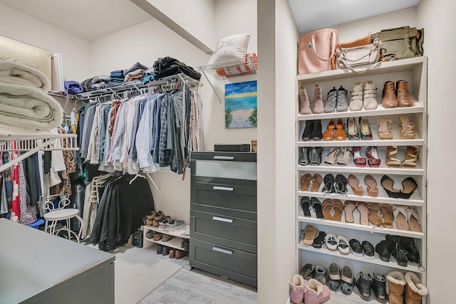 spacious closet featuring wood finished floors