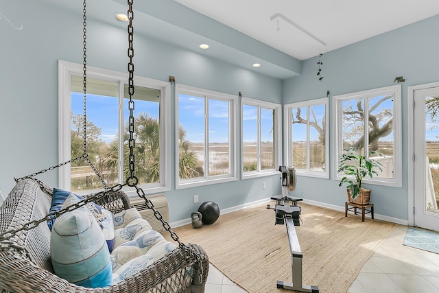 workout area featuring tile patterned flooring, recessed lighting, and baseboards