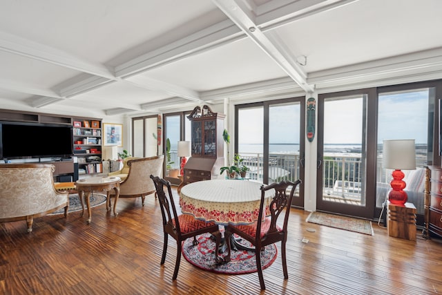 dining area featuring coffered ceiling, beamed ceiling, hardwood / wood-style flooring, and a healthy amount of sunlight