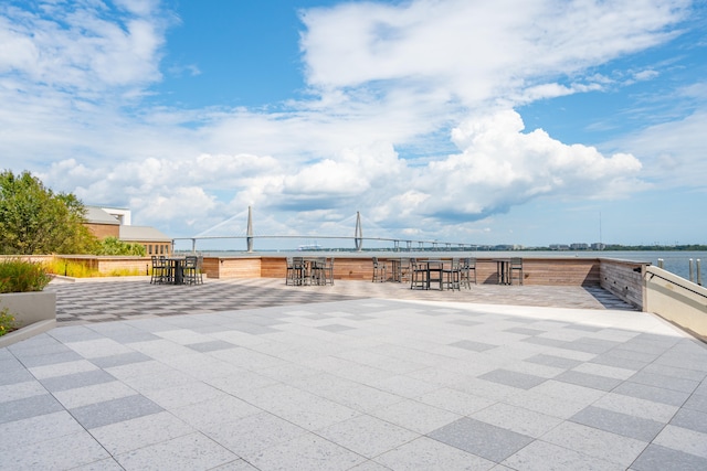 view of patio / terrace with a water view