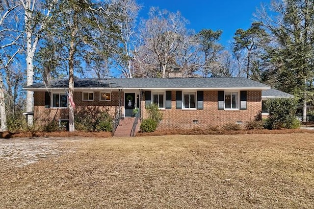 ranch-style home with crawl space, a front lawn, brick siding, and a shingled roof