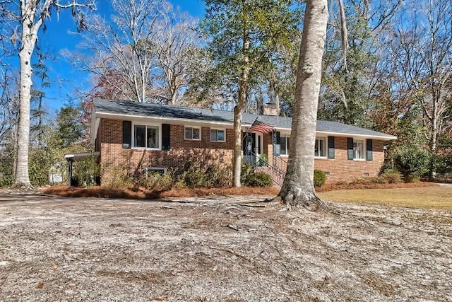 ranch-style house with brick siding and crawl space