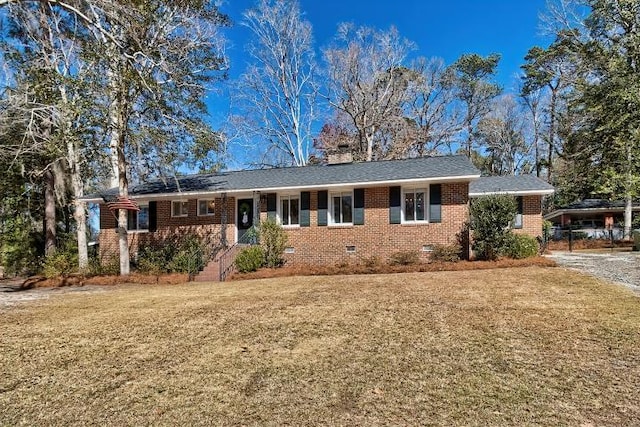 ranch-style house featuring crawl space, brick siding, and a front yard