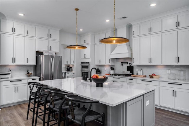 2408 Bent Oak Rd, Mount Pleasant, SC 29466 - kitchen featuring stainless steel appliances, decorative backsplash, wood finished floors, white cabinets, and recessed lighting