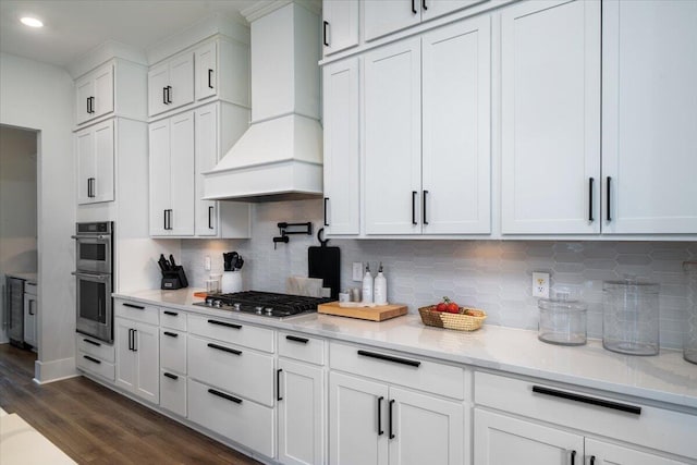 2408 Bent Oak Rd, Mount Pleasant, SC 29466 - kitchen featuring custom exhaust hood, stainless steel appliances, white cabinets, dark wood finished floors, and decorative backsplash