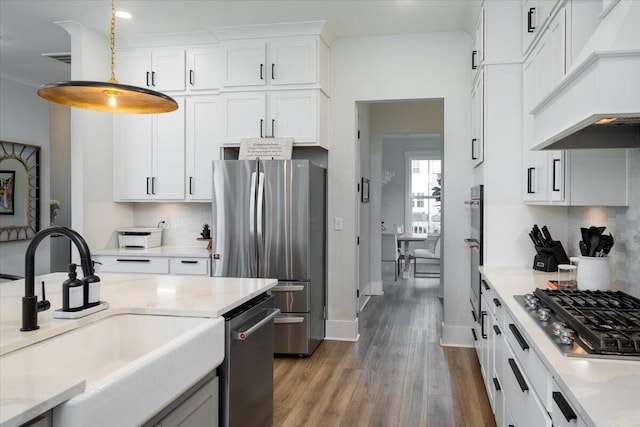 2408 Bent Oak Rd, Mount Pleasant, SC 29466 - kitchen featuring stainless steel appliances, custom range hood, wood finished floors, decorative backsplash, and recessed lighting