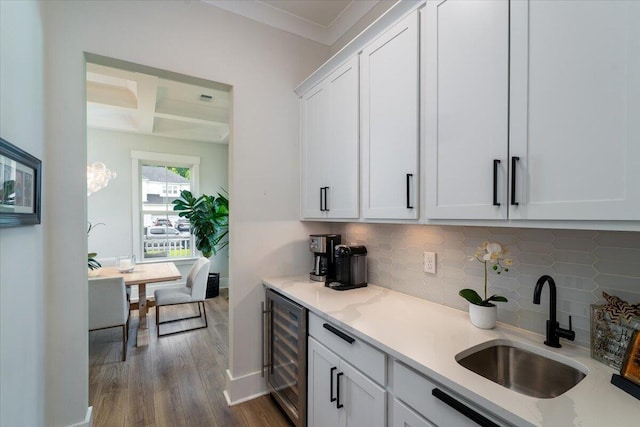 2408 Bent Oak Rd, Mount Pleasant, SC 29466 - kitchen featuring beverage cooler, dark wood-style flooring, tasteful backsplash, white cabinets, and beamed ceiling