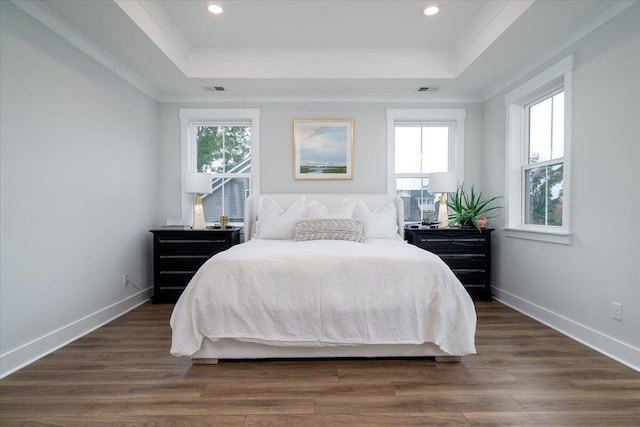 2408 Bent Oak Rd, Mount Pleasant, SC 29466 - bedroom featuring a tray ceiling, ornamental molding, dark wood-style flooring, and recessed lighting