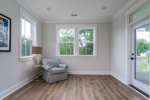 2408 Bent Oak Rd, Mount Pleasant, SC 29466 - living area featuring healthy amount of natural light, crown molding, and light wood-style flooring