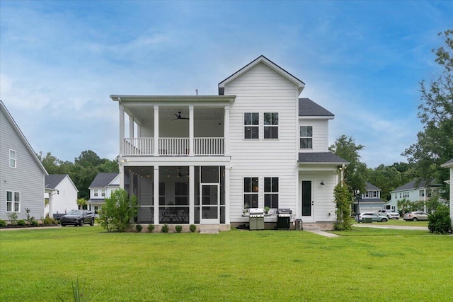 2408 Bent Oak Rd, Mount Pleasant, SC 29466 - back of house featuring ceiling fan, a balcony, a sunroom, and a yard