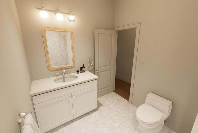 bathroom with toilet and vanity