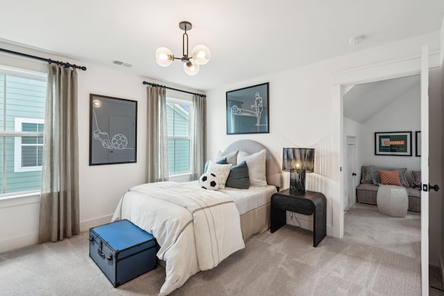 carpeted bedroom with lofted ceiling and a chandelier