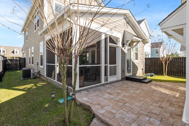 207 Billinger St, Summerville, SC 29486 - back of house with central AC, a lawn, a fenced backyard, a sunroom, and a patio area
