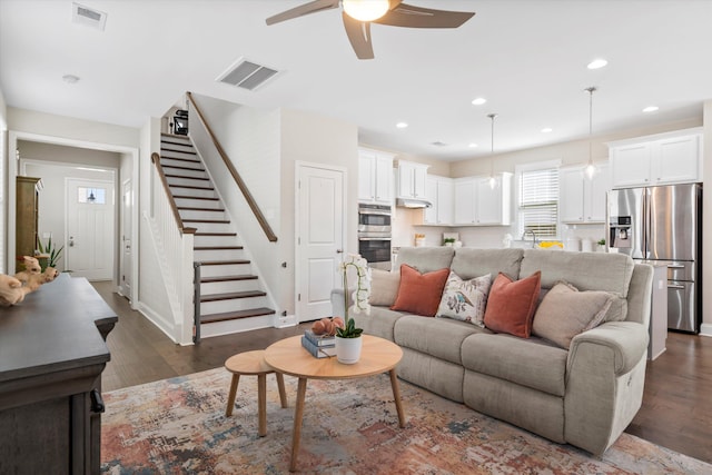 207 Billinger St, Summerville, SC 29486 - living room with stairs, dark wood-style floors, a ceiling fan, and visible vents