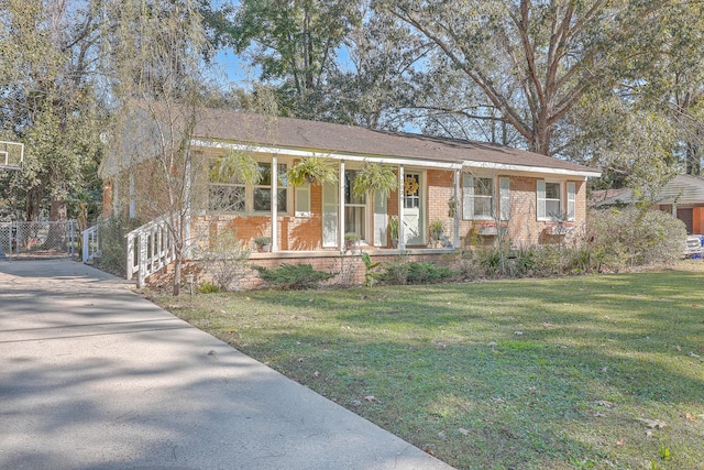 view of front of property with a porch and a front yard