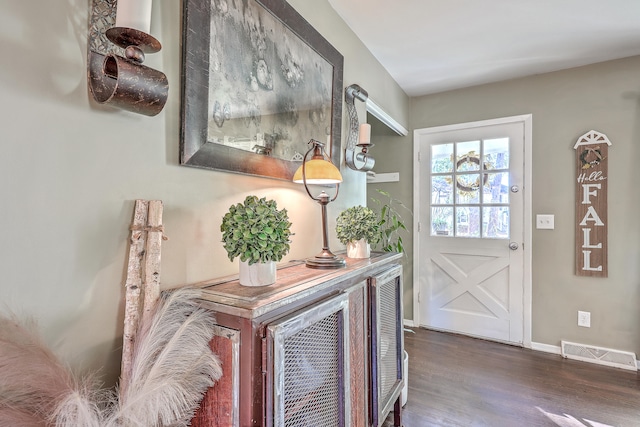 doorway to outside featuring dark hardwood / wood-style flooring