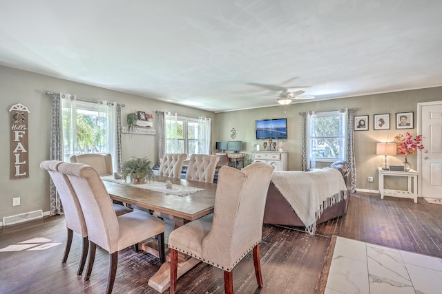 dining room with dark hardwood / wood-style floors and ceiling fan