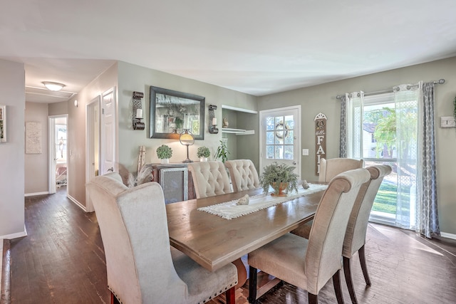 dining area with dark hardwood / wood-style flooring