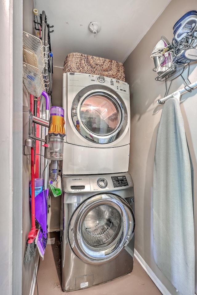 laundry room with stacked washer and clothes dryer