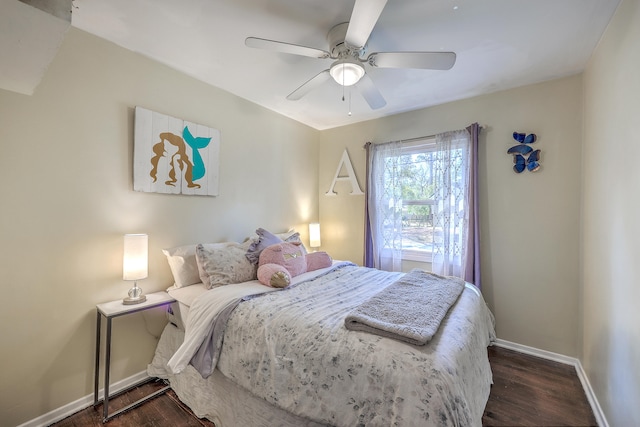 bedroom with ceiling fan and dark hardwood / wood-style flooring