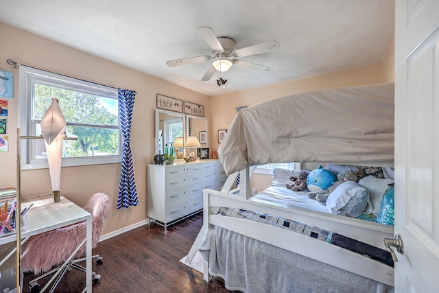 bedroom featuring ceiling fan and dark hardwood / wood-style flooring