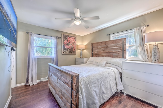 bedroom featuring dark hardwood / wood-style flooring and ceiling fan