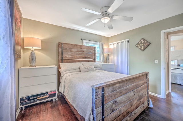 bedroom with ceiling fan and dark hardwood / wood-style floors