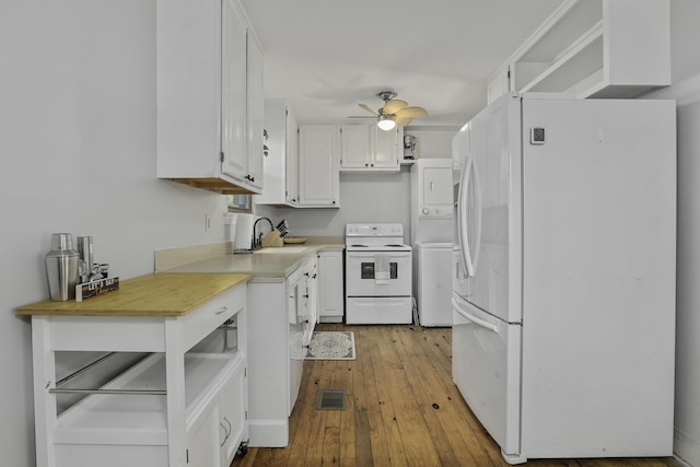 kitchen featuring white cabinetry, white appliances, ceiling fan, and sink