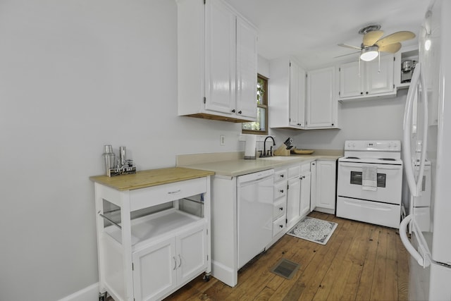 kitchen with sink, white appliances, dark hardwood / wood-style floors, ceiling fan, and white cabinets