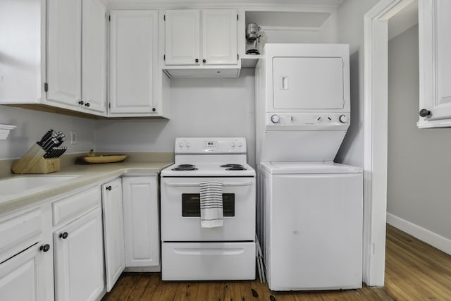 kitchen with electric stove, white cabinetry, dark hardwood / wood-style flooring, and stacked washer / dryer