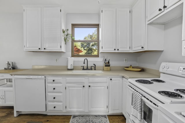 kitchen with white cabinetry and white appliances