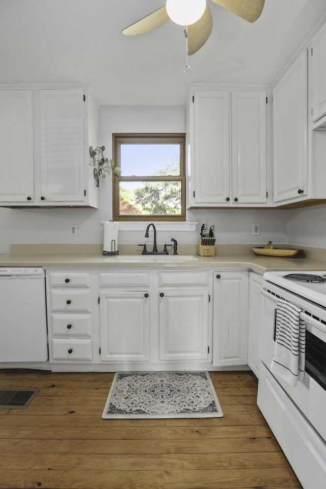 kitchen featuring white cabinetry, dark wood-type flooring, ceiling fan, and white appliances