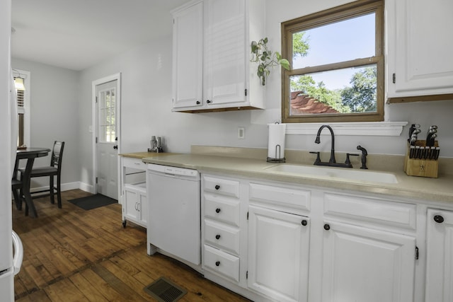 kitchen with white cabinetry, dishwasher, and sink