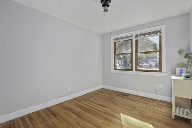 empty room with light hardwood / wood-style floors