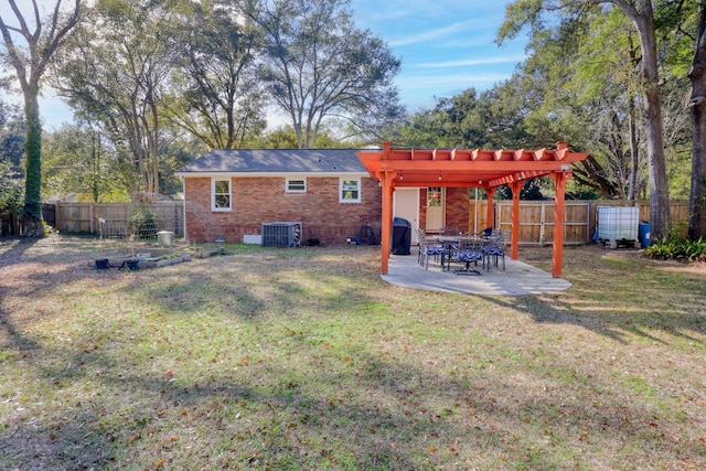 view of yard featuring a pergola, a patio area, and central air condition unit