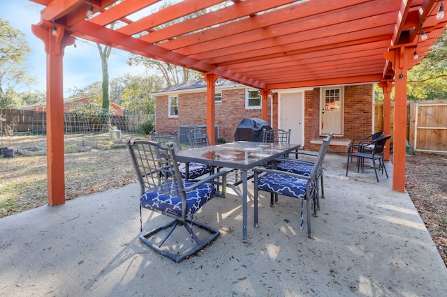 view of patio featuring area for grilling and a pergola