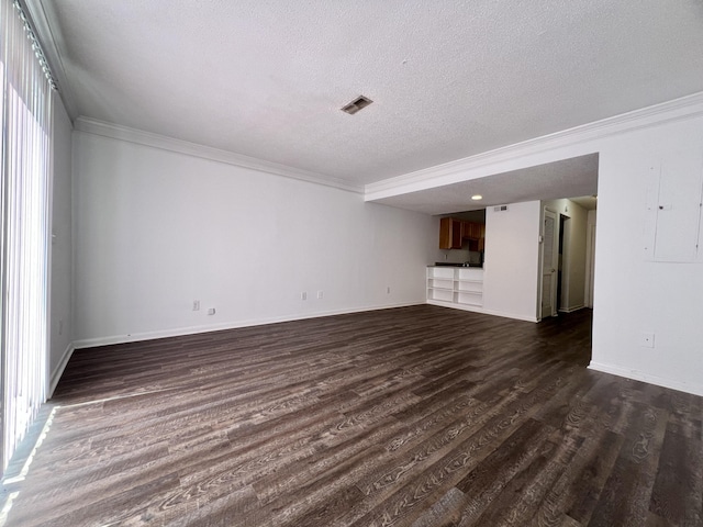 unfurnished living room featuring a textured ceiling, dark hardwood / wood-style floors, and ornamental molding