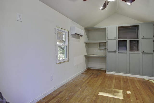 6094 Chisolm Rd, Johns Island, SC 29455 - unfurnished room with ceiling fan, a wall mounted air conditioner, lofted ceiling, light wood finished floors, and baseboards