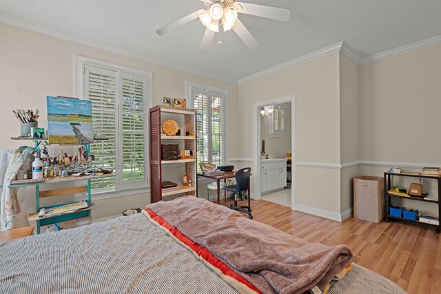 bedroom featuring wood finished floors, ornamental molding, baseboards, and ceiling fan