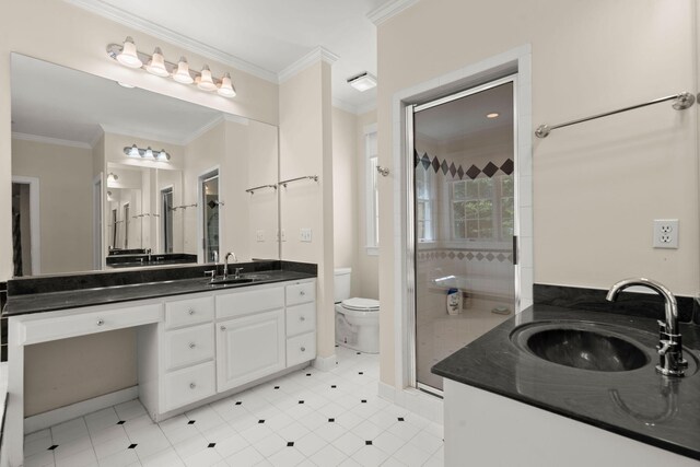 bathroom featuring a shower stall, vanity, crown molding, and toilet