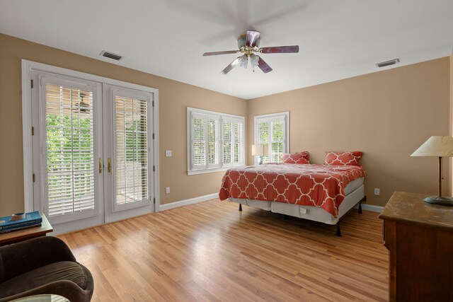 bedroom featuring access to exterior, light wood-style floors, baseboards, and a ceiling fan