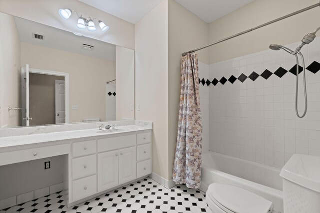 full bathroom featuring toilet, shower / tub combo, vanity, and baseboards