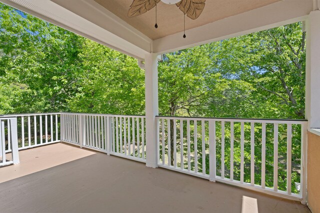 view of patio / terrace with ceiling fan and a balcony