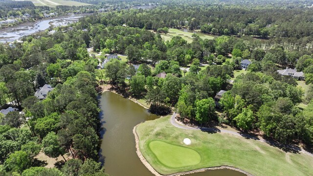 aerial overview of property's location featuring a local golf course and a large body of water