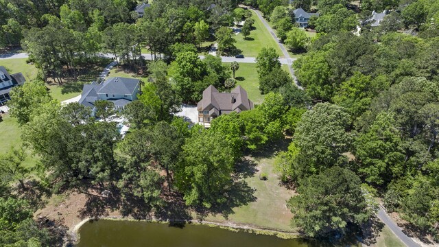 aerial view of property and surrounding area featuring a large body of water