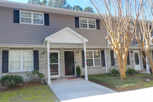 view of property featuring brick siding