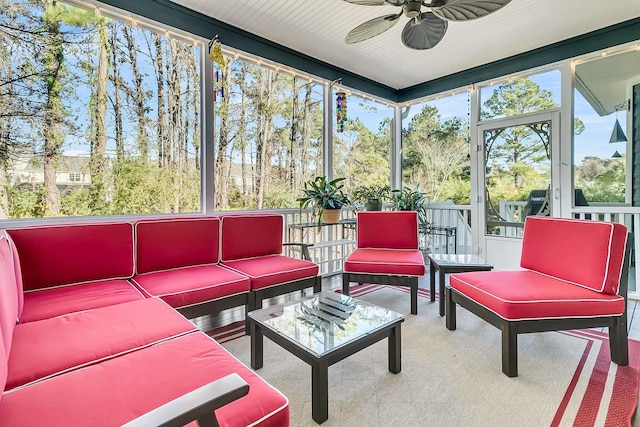 sunroom / solarium with ceiling fan