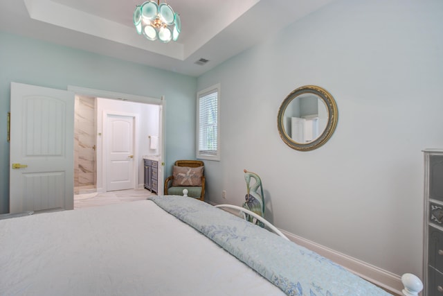 16 Oakwood Ln, Edisto Island, SC 29438 - bedroom with ensuite bathroom and a chandelier